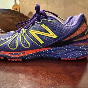 New Balance Women's Vibrant Purple and Orange Sneakers
Worn once!